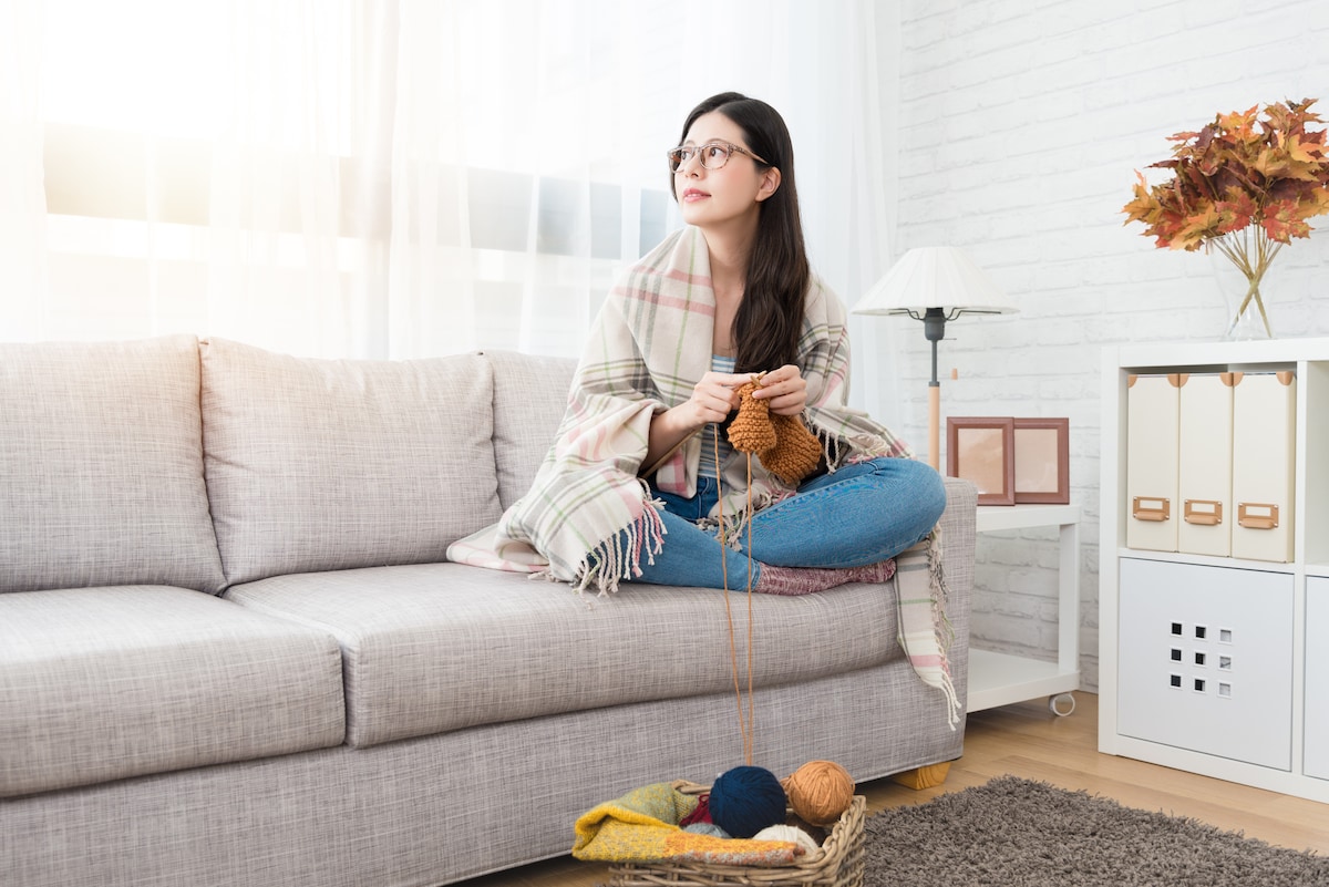 A woman sitting on the couch