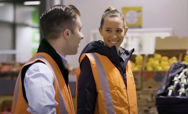 Two workers from the LaManna Premier Group wearing hi-vis vests