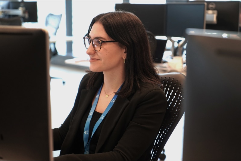 A customer solutions team member working at her desk