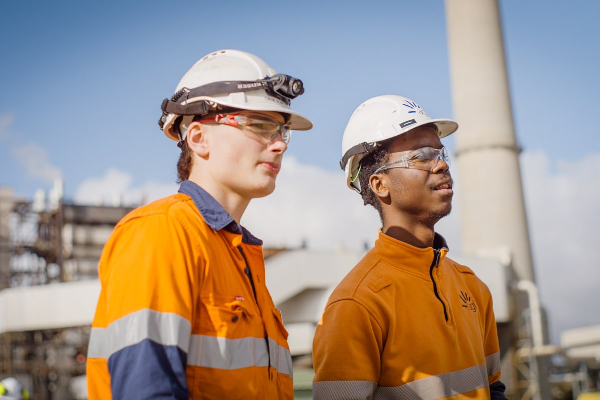 AGL team members on the roof of a building inspecting equipment