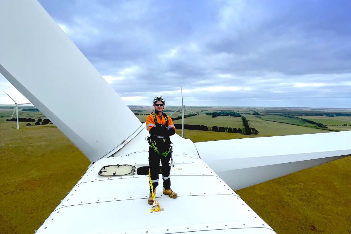 Jed, an AGL team member working on top of a turbine at a wind farm