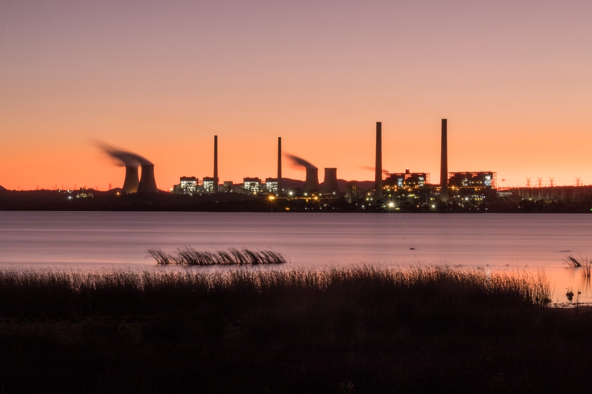 Sunset view of the Bayswater Power Station with steam rising from the cooling towers.