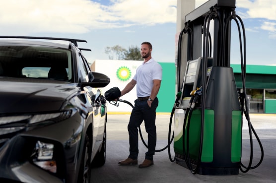 A man filling up petrol at BP station