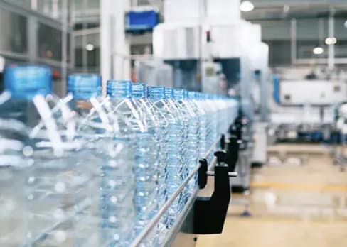 Empty water bottles on a production line in a factory